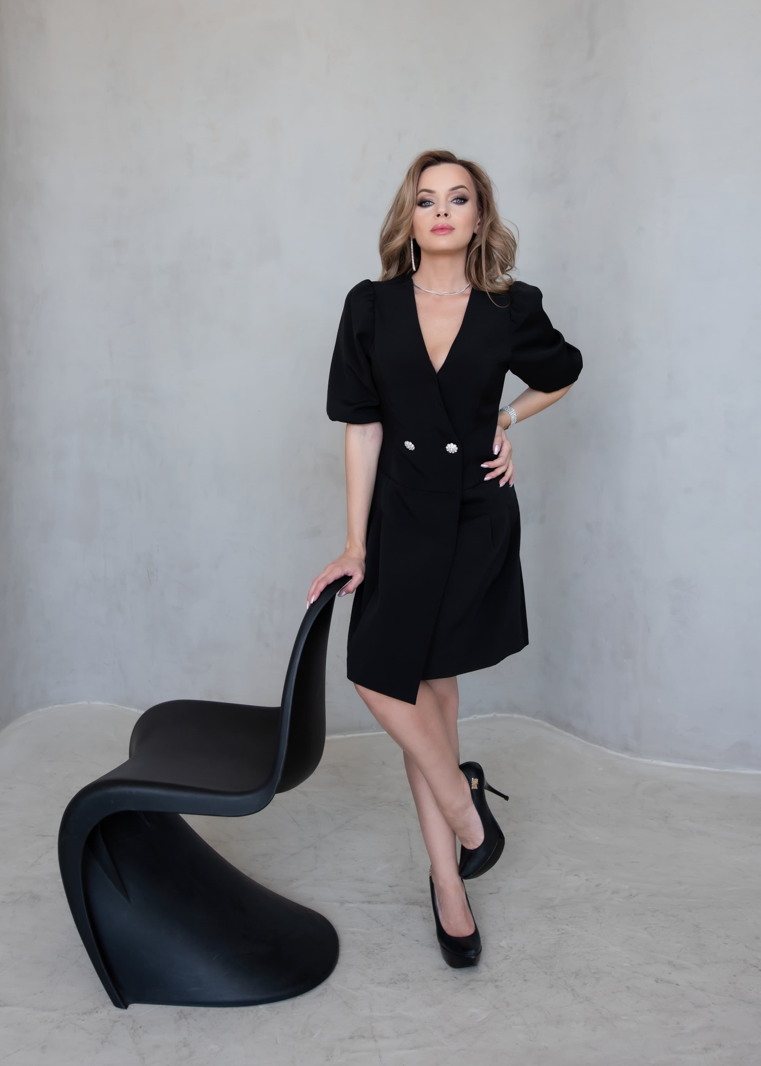 Veronika Brook in a black coat